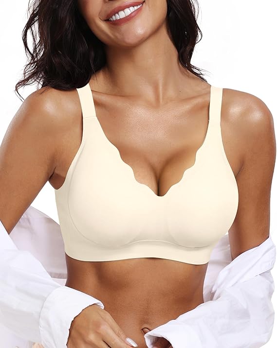 Light-colored seamless bra with scalloped edges and wide straps, shown under an off‑shoulder white shirt for a soft, minimal, comfortable look