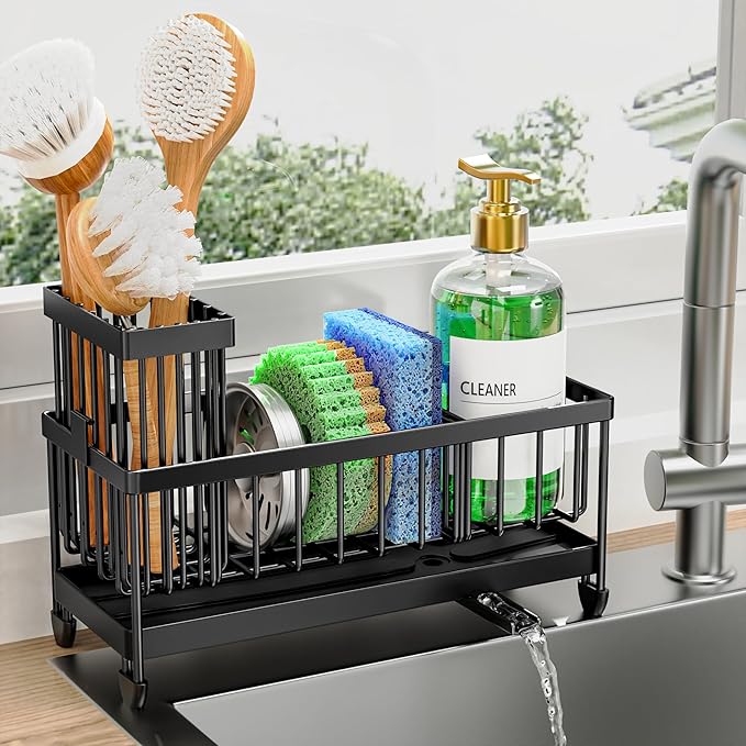 Kitchen sink organizer holding dish brushes, colorful sponges, a metal scrubber, and a soap dispenser on a countertop beside a modern faucet.